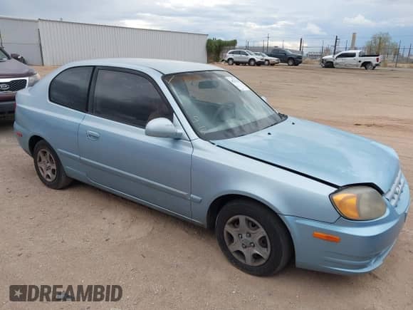 2005 Hyundai Accent GLS z VIN KMHCG35C35U361960, wystawiony jako IAAI lot #43243568 z przebiegiem 163 217 mil mil oraz . Historia ofert i sprzedaży dostępna na DreamBid. Obrazek 1.