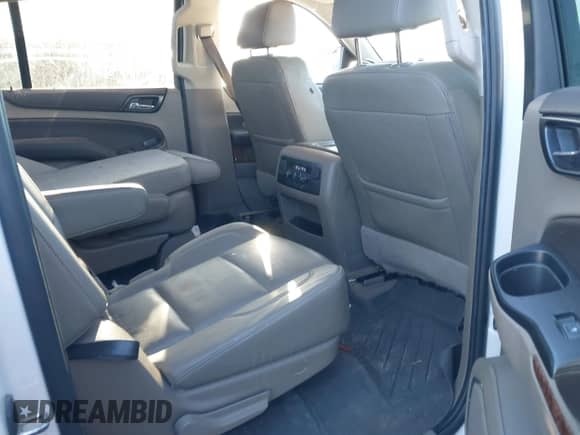 2019 Chevrolet Suburban Premier with VIN 1GNSCJKC0KR293658, listed as a IAAI auction lot 40563834 with 153,619 mi miles and . Bid and sale history available at DreamBid. Image 8.