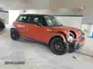 2013 MINI Hardtop S with VIN WMWSV3C52DT396176, listed as a Copart auction lot 59207165 with 104,194 mi miles and Salvage title. Bid and sale history available at DreamBid. Image 4.