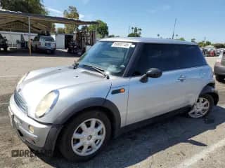 2004 MINI Hardtop with VIN WMWRC33404TJ62937, listed as a Copart auction lot 69888145 with 94,099 mi miles and Salvage title. Bid and sale history available at DreamBid. Image 1.