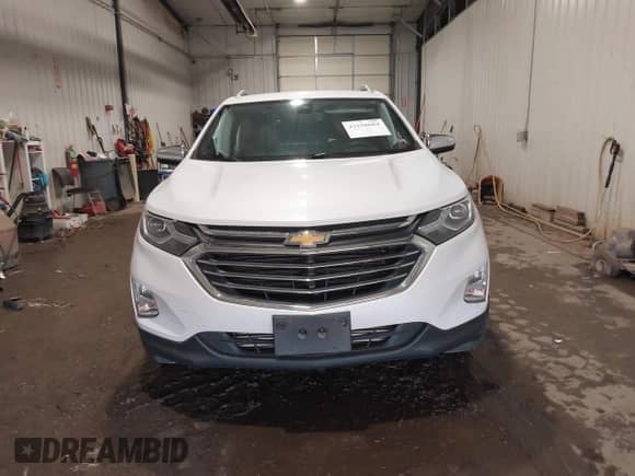 2018 Chevrolet Equinox Premier z VIN 2GNAXVEV6J6303124, wystawiony jako IAAI lot #43150684 z przebiegiem 91 946 mil mil oraz . Historia ofert i sprzedaży dostępna na DreamBid. Obrazek 13.