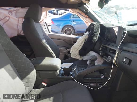 2024 Toyota Tacoma SR with VIN 3TYKD5HN4RT016047, listed as a IAAI auction lot 41335702 with Not provided miles and . Bid and sale history available at DreamBid. Image 5.