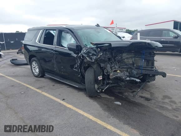 2021 Chevrolet Tahoe LT z VIN 1GNSCNKD5MR266166, wystawiony jako IAAI lot #42921471 z przebiegiem 99 800 mil mil oraz . Historia ofert i sprzedaży dostępna na DreamBid. Obrazek 1.