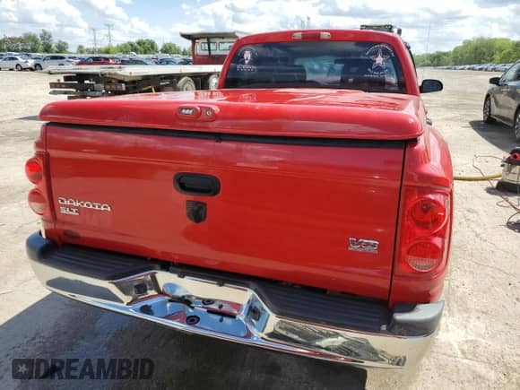 2006 Dodge Dakota SLT with VIN 1D7HE48N56S504462, listed as a Copart auction lot 56487105 with 148,333 mi miles and Salvage title. Bid and sale history available at DreamBid. Image 6.