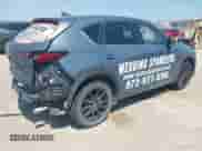 2022 Mazda CX-5 S Preferred with VIN JM3KFBCM9N0529494, listed as a IAAI auction lot 43179890 with 57,495 mi miles and . Bid and sale history available at DreamBid. Image 4.