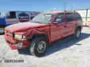 1999 Dodge Durango with VIN 1B4HS28Z1XF528727, listed as a Copart auction lot 77621824 with 164,880 mi miles and Salvage title. Bid and sale history available at DreamBid. Image 1.