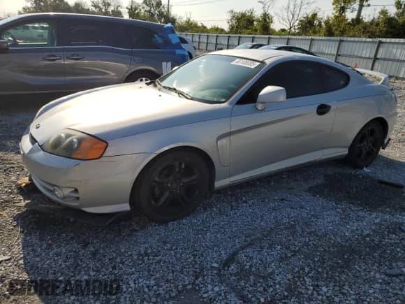 2004 Hyundai Tiburon GT с VIN KMHHN65F94U153507, выставлен на аукционе Copart как лот 66108085 с пробегом 113 413 миль миль и Списание • Salvage title. История ставок и продаж доступна на DreamBid. Изображение 1.