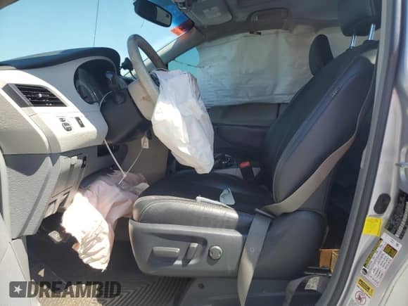 2012 Toyota Sienna SE with VIN 5TDXK3DC9CS183950, listed as a Copart auction lot 70873765 with 180,359 mi miles and Salvage title. Bid and sale history available at DreamBid. Image 7.
