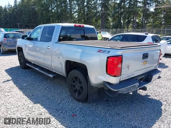2014 Chevrolet Silverado 1500 LTZ with VIN 1GCUKSEC4EF197043, listed as a IAAI auction lot 42673341 with 131,445 mi miles and . Bid and sale history available at DreamBid. Image 3.