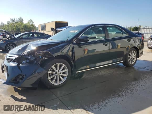 2012 Toyota Camry LE with VIN 4T4BF1FKXCR212246, listed as a Copart auction lot 82117065 with 173,749 mi miles and Salvage title. Bid and sale history available at DreamBid. Image 1.