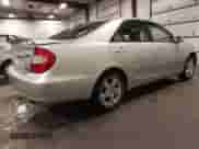 2002 Toyota Camry LE z VIN 4T1BE32K02U033310, wystawiony jako IAAI lot #42586585 z przebiegiem 154 658 mil mil oraz . Historia ofert i sprzedaży dostępna na DreamBid. Obrazek 4.