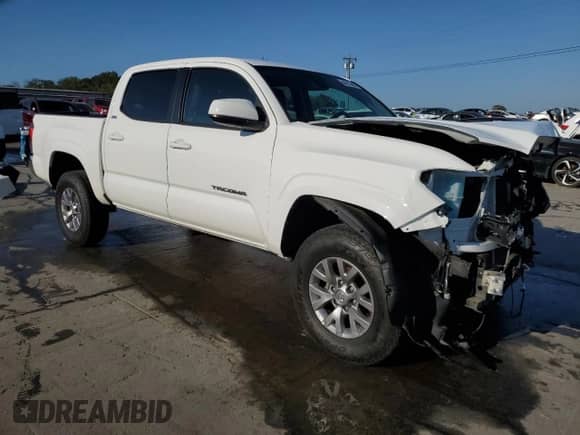 2020 Toyota Tacoma SR with VIN 5TFAX5GN3LX165499, listed as a Copart auction lot 84973885 with 67,043 mi miles and Salvage title. Bid and sale history available at DreamBid. Image 4.
