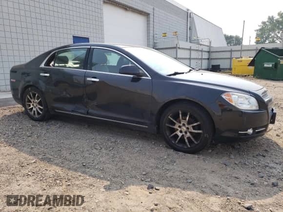 2010 Chevrolet Malibu LTZ with VIN 1G1ZE5E00AF136036, listed as a Copart auction lot 65701985 with 227,332 mi miles and Salvage title. Bid and sale history available at DreamBid. Image 4.