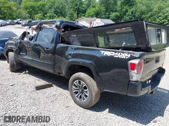 2021 Toyota Tacoma SR5 z VIN 3TYDZ5BN1MT002778, wystawiony jako IAAI lot #42591088 z przebiegiem Nie podano mil oraz . Historia ofert i sprzedaży dostępna na DreamBid. Obrazek 3.