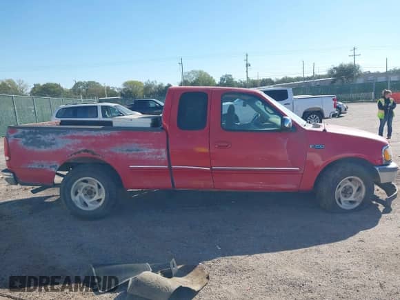 1998 Ford F-150 with VIN 1FTZX1720WNC17821, listed as a IAAI auction lot 43436377 with 257,557 mi miles and . Bid and sale history available at DreamBid. Image 13.