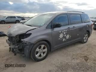 2015 Toyota Sienna LE with VIN 5TDKK3DC0FS613542, listed as a Copart auction lot 86701935 with 191,958 mi miles and Salvage title. Bid and sale history available at DreamBid. Image 1.