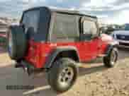 2000 Jeep Wrangler SE with VIN 1J4FA29P4YP798115, listed as a Copart auction lot 80751605 with 119,345 mi miles and Salvage title. Bid and sale history available at DreamBid. Image 3.