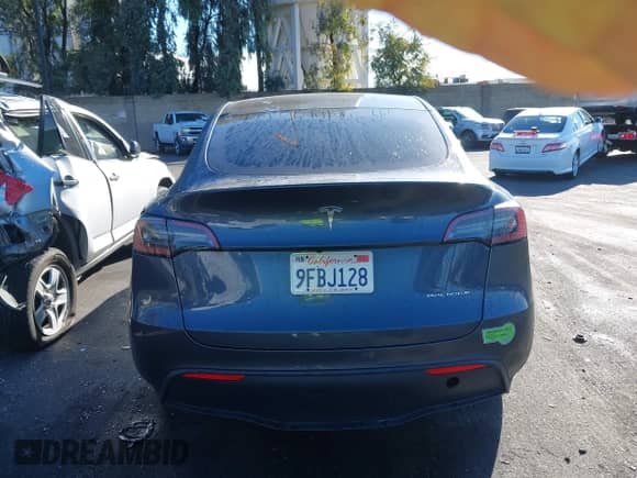 2023 Tesla Model Y Long Range with VIN 7SAYGAEE9PF662232, listed as a IAAI auction lot 43442303 with 42,636 mi miles and . Bid and sale history available at DreamBid. Image 17.