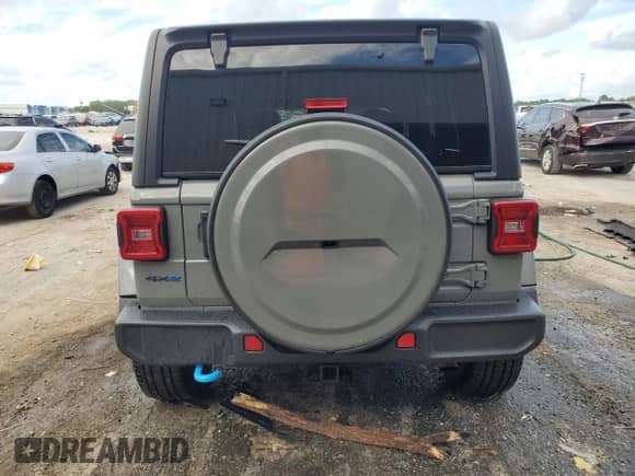 2023 Jeep Wrangler Sahara с VIN 1C4JJXP67PW605290, выставлен на аукционе Copart как лот 85527815 с пробегом Не указан миль и На запчасти • Non repairable. История ставок и продаж доступна на DreamBid. Изображение 6.