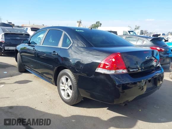2014 Chevrolet Impala LS with VIN 2G1WA5E31E1140182, listed as a IAAI auction lot 43302098 with 150,453 mi miles and . Bid and sale history available at DreamBid. Image 3.