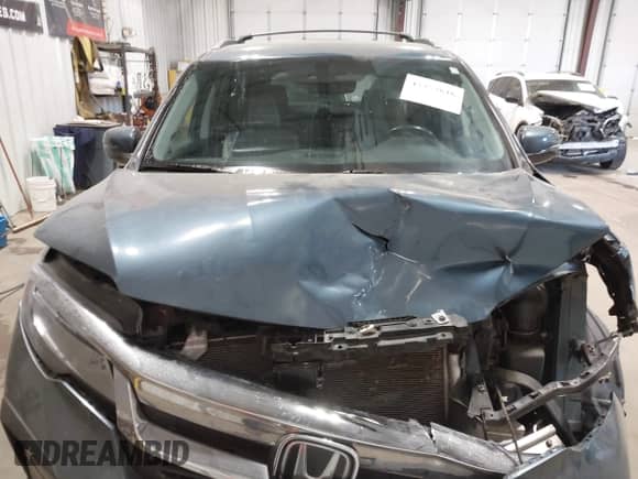 2019 Honda Pilot Touring 7-Passenger with VIN 5FNYF6H64KB004134, listed as a IAAI auction lot 43353616 with 92,735 mi miles and . Bid and sale history available at DreamBid. Image 13.