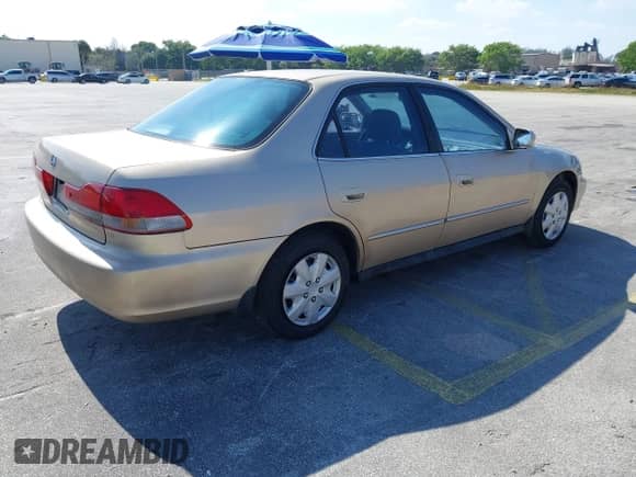 2002 Honda Accord LX with VIN 1HGCG56472A108436, listed as a IAAI auction lot 41477914 with 148,508 mi miles and . Bid and sale history available at DreamBid. Image 4.