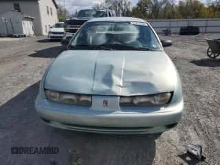 1997 Saturn SL with VIN 1G8ZK5274VZ271990, listed as a Copart auction lot 87279155 with 147,825 mi miles and Salvage title. Bid and sale history available at DreamBid. Image 5.