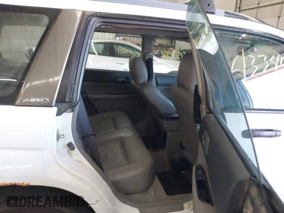 2004 Subaru Forester XS with VIN JF1SG65604H702031, listed as a IAAI auction lot 43345798 with 169,814 mi miles and . Bid and sale history available at DreamBid. Image 8.
