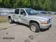 2003 Dodge Dakota Sport с VIN 1D7HG38N23S309001, выставлен на аукционе Copart как лот 56595945 с пробегом 130 864 миль миль и Списание • Salvage title. История ставок и продаж доступна на DreamBid. Изображение 4.