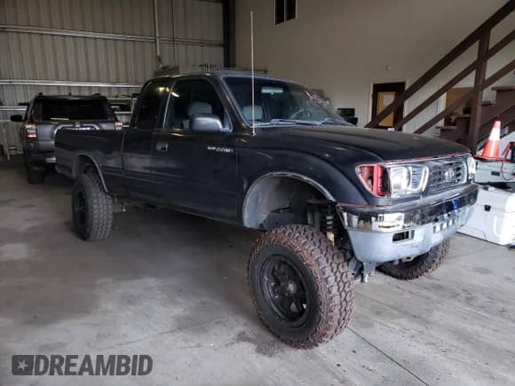 1997 Toyota Tacoma z VIN 4TAWN72N8VZ275224, wystawiony jako Copart lot #53267355 z przebiegiem 258 016 mil mil oraz Szkoda całkowita • Salvage title. Historia ofert i sprzedaży dostępna na DreamBid. Obrazek 4.