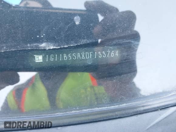 2013 Chevrolet Malibu LS z VIN 1G11B5SA8DF133764, wystawiony jako IAAI lot #43386334 z przebiegiem 166 541 mil mil oraz . Historia ofert i sprzedaży dostępna na DreamBid. Obrazek 9.