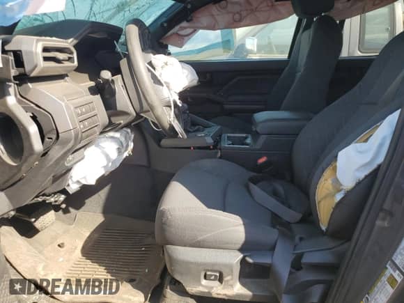 2025 Toyota Tacoma SR5 with VIN 3TMKB5FN1SM038291, listed as a Copart auction lot 64888865 with 3,992 mi miles and Salvage title. Bid and sale history available at DreamBid. Image 7.
