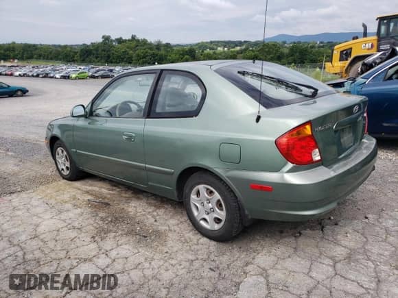 2005 Hyundai Accent GLS с VIN KMHCG35C05U325871, выставлен на аукционе Copart как лот 64258985 с пробегом 166 574 миль миль и Списание • Salvage title. История ставок и продаж доступна на DreamBid. Изображение 2.