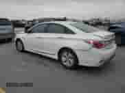 2013 Hyundai Sonata Limited z VIN KMHEC4A45DA083054, wystawiony jako Copart lot #70295075 z przebiegiem 115 616 mil mil oraz Szkoda całkowita • Salvage title. Historia ofert i sprzedaży dostępna na DreamBid. Obrazek 2.