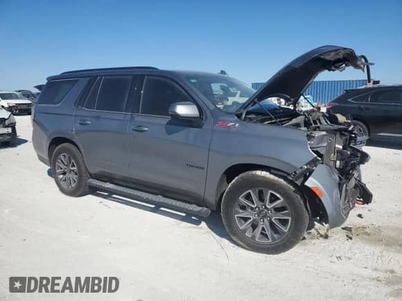 2022 Chevrolet Tahoe Z71 with VIN 1GNSKPKL5NR141563, listed as a Copart auction lot 45292915 with 30,715 mi miles and Salvage title. Bid and sale history available at DreamBid. Image 4.