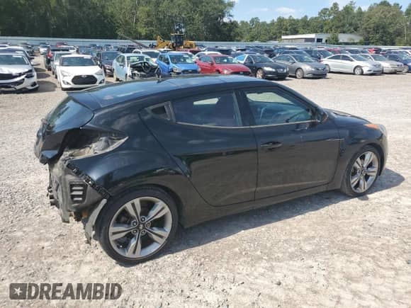 2012 Hyundai Veloster w/Gray Int z VIN KMHTC6AD1CU077462, wystawiony jako Copart lot #81556725 z przebiegiem 133 710 mil mil oraz Szkoda całkowita • Salvage title. Historia ofert i sprzedaży dostępna na DreamBid. Obrazek 3.