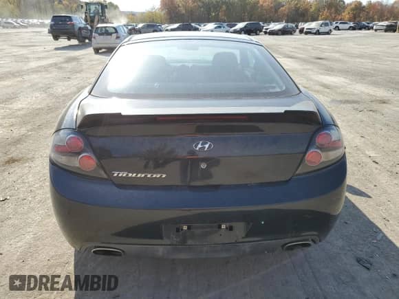 2007 Hyundai Tiburon GS with VIN KMHHM66D37U237424, listed as a Copart auction lot 77363534 with 160,018 mi miles and Salvage title. Bid and sale history available at DreamBid. Image 6.