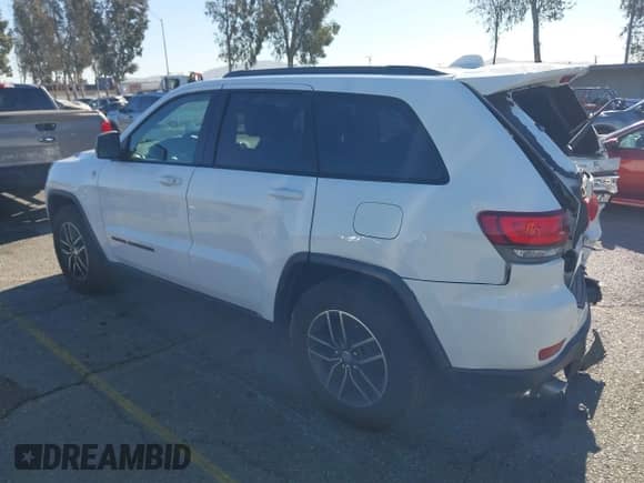 2017 Jeep Grand Cherokee Trailhawk z VIN 1C4RJFLGXHC959092, wystawiony jako IAAI lot #41232281 z przebiegiem 108 659 mil mil oraz . Historia ofert i sprzedaży dostępna na DreamBid. Obrazek 3.