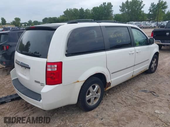 2010 Dodge Grand Caravan SXT with VIN 2D4RN5D16AR342815, listed as a IAAI auction lot 43043040 with 302,074 mi miles and . Bid and sale history available at DreamBid. Image 4.