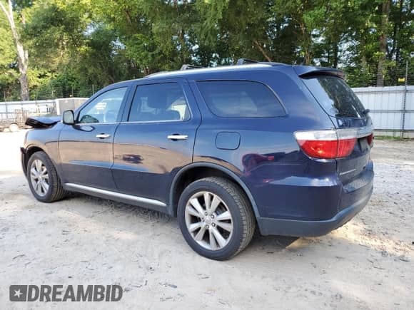 2013 Dodge Durango Crew with VIN 1C4RDHDG1DC530242, listed as a Copart auction lot 62873485 with 134,323 mi miles and Salvage title. Bid and sale history available at DreamBid. Image 2.
