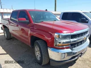2018 Chevrolet Silverado 1500 LT z VIN 3GCUKREC1JG155981, wystawiony jako IAAI lot #43199544 z przebiegiem 101 035 mil mil oraz . Historia ofert i sprzedaży dostępna na DreamBid. Obrazek 1.