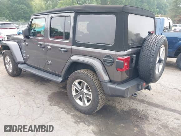 2021 Jeep Wrangler Unlimited Sahara Altitude with VIN 1C4HJXEG7MW776529, listed as a IAAI auction lot 42911866 with 51,748 mi miles and . Bid and sale history available at DreamBid. Image 3.