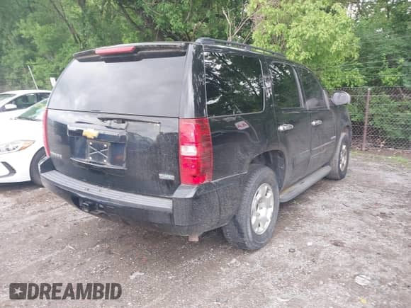 2010 Chevrolet Tahoe LS with VIN 1GNMCAE36AR176492, listed as a IAAI auction lot 42445566 with 203,265 mi miles and . Bid and sale history available at DreamBid. Image 4.