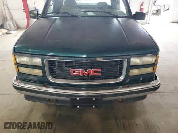 1995 GMC Sierra 1500 z VIN 2GTEC19K2S1558740, wystawiony jako Copart lot #69398185 z przebiegiem 386 899 mil mil oraz Szkoda całkowita • Salvage title. Historia ofert i sprzedaży dostępna na DreamBid. Obrazek 11.