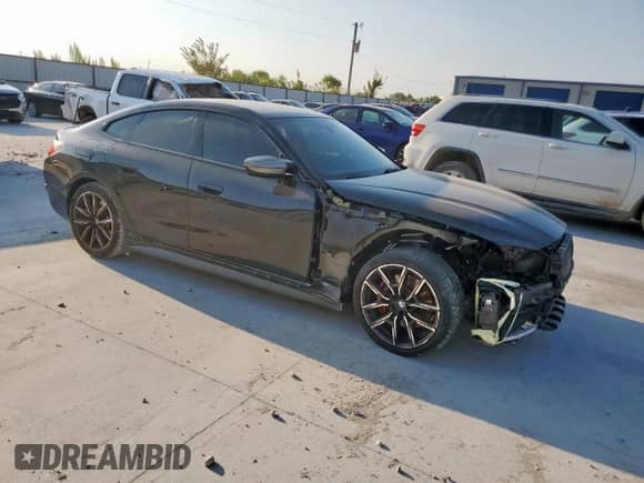 2022 BMW 4 Series M440i xDrive с VIN WBA13AW00NFM45784, выставлен на аукционе Copart как лот 80872155 с пробегом 23 333 миль миль и Списание • Salvage title. История ставок и продаж доступна на DreamBid. Изображение 4.