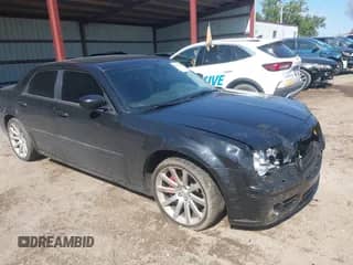 2006 Chrysler 300 C SRT-8 with VIN 2C3KA73W56H332748, listed as a IAAI auction lot 43292460 with 168,014 mi miles and . Bid and sale history available at DreamBid. Image 1.