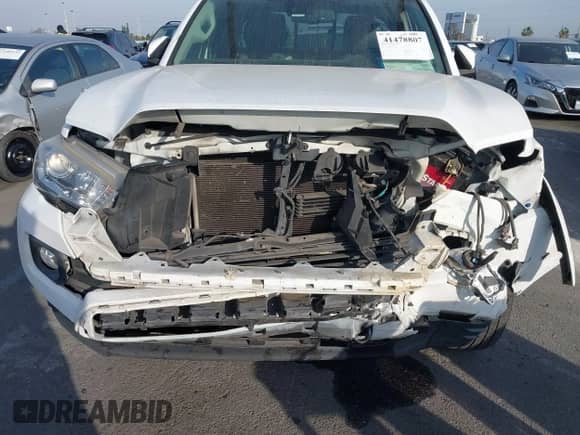 2018 Toyota Tacoma SR5 with VIN 5TFRZ5CN3JX064821, listed as a IAAI auction lot 41478807 with 106,495 mi miles and . Bid and sale history available at DreamBid. Image 6.