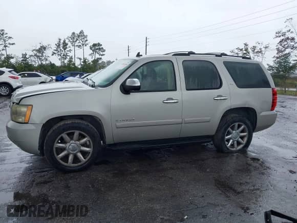 2007 Chevrolet Tahoe LT with VIN 1GNFC130X7R189031, listed as a IAAI auction lot 43403595 with 167,774 mi miles and . Bid and sale history available at DreamBid. Image 14.