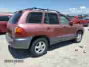 2004 Hyundai Santa Fe z VIN KM8SB12B74U770505, wystawiony jako Copart lot #62756304 z przebiegiem Nie podano mil oraz Szkoda całkowita • Salvage title. Historia ofert i sprzedaży dostępna na DreamBid. Obrazek 3.