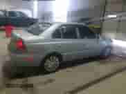 2005 Hyundai Accent GLS z VIN KMHCG45C65U662633, wystawiony jako Copart lot #86432595 z przebiegiem 221 608 mil mil oraz Szkoda całkowita • Salvage title. Historia ofert i sprzedaży dostępna na DreamBid. Obrazek 3.